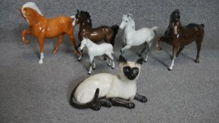 A collection of porcelain animals including five hand painted porcelain Beswick horses, makers stamp