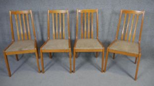 A set of four vintage dining chairs.