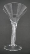 An 18th century air twist stem conical wine glass with drawn trumpet design and circular foot with