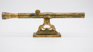 An antique brass telescope by Stanley, London, number 9861. W. 34