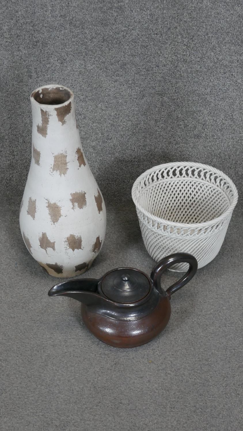 A collection of ceramics. Including a white Italian porcelain woven planter, an Art Deco stone