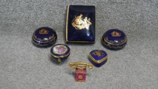 A collection of royal blue and gold Limoges trinket boxes and miniature telephone. Makers mark to