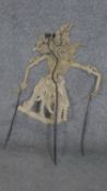 An Indonesian shadow puppet from the island of Java. Made of hide with horn rods. H.74CM