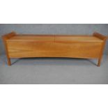 A contemporary Biedermeier style hall bench with hinged lidded storage compartments, retailed by