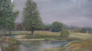A framed and glazed pastel, parkland scene with lake, indistinctly signed. H.63 W.71cm