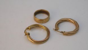A pair of 9 carat gold hoop twist earrings with pierced clip fittings, hallmarked 9 carat and a 9