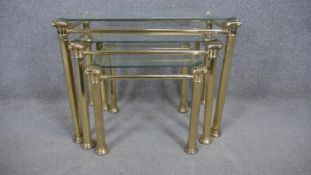 A nest of three Maison Jansen style glass topped occasional tables. H.49 W.63 D.40cm