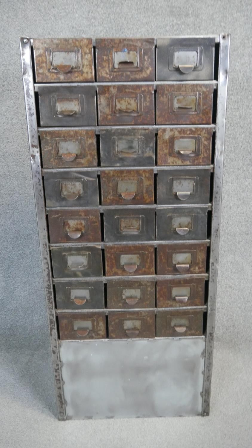 A vintage metal filing cabinet with a bank of twenty four small drawers. H.110 W.100 D.50cm