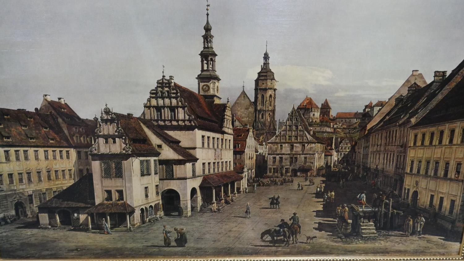 A large gilt framed print on canvas of 'Market Place at Pirna' by Canaletto. H. 75 W. 117