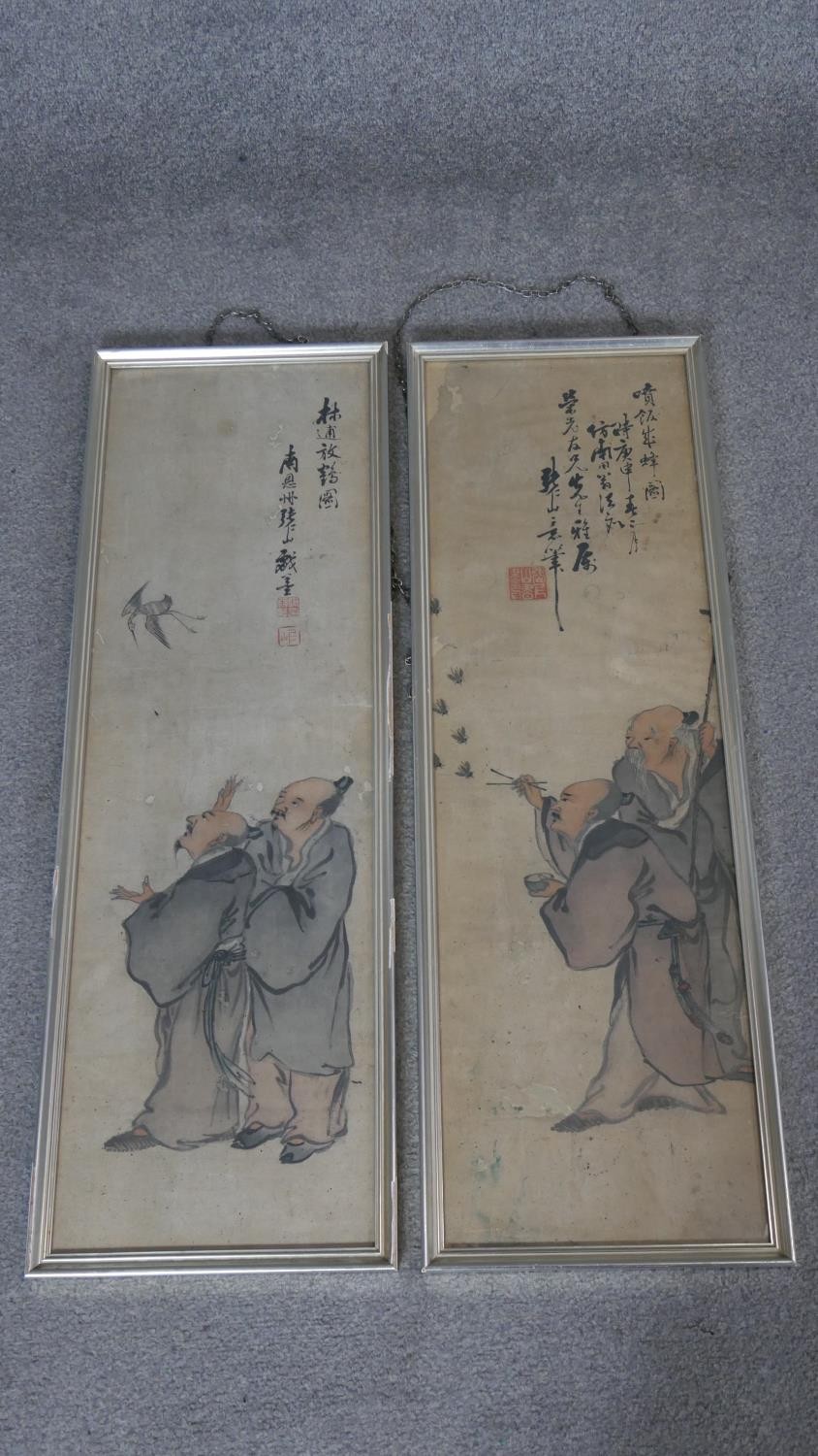 Two framed and glazed Chinese late Ming - Qing period inks on paper. Each one depicting two scholars