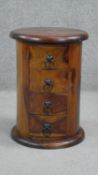 An Eastern hardwood cylindrical pedestal chest of four drawers on plinth base. H. 56 D. 38