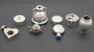 A collection of white metal and silver novelty items. Including two silver scent bottles, one with a