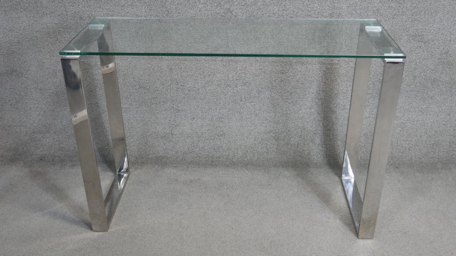 A vintage style console table with plate glass top on chromium base. H.75 x W.110 x D.40cm