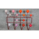 Charles and Ray Eames for Vitra, a Hang it All wall hanging coat rack. H.38 x W.50cm