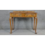 A mid century Georgian style burr walnut and crossbanded side table on slender carved cabriole