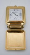 CHOPARD - A vintage gold plated square travel alarm clock. Quartz movement with Chopard leather case