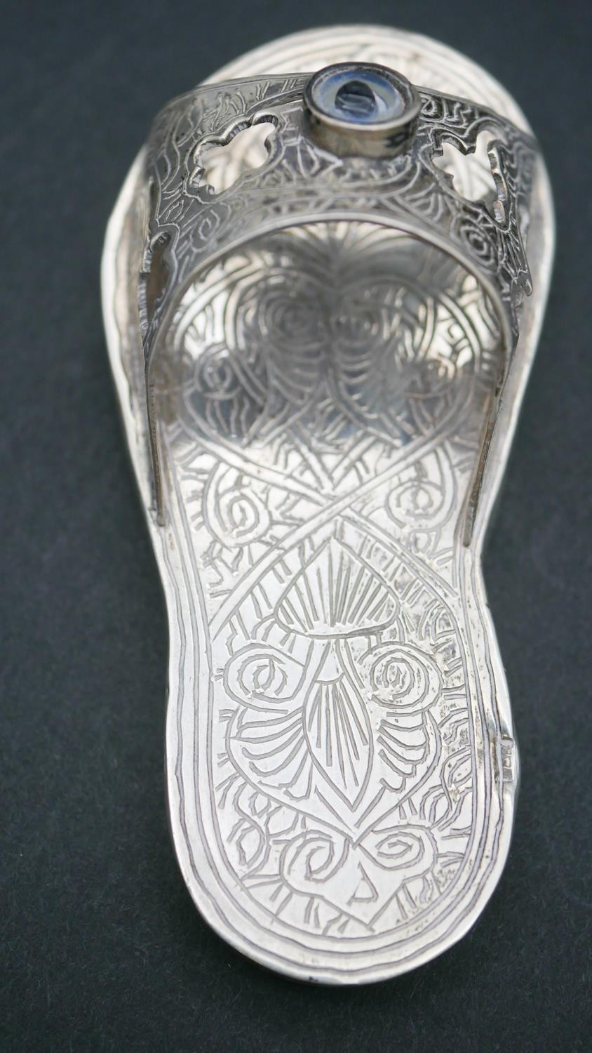 A collection of silver items. Including a silver sandal with engraved detailing, two foliate - Image 2 of 4