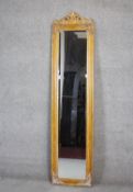 A full height dressing mirror in decorative gilt frame with shell carved cresting on an easel stand.