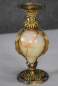 A gilt brass alabaster and cloisonne enamel urn candle holder with stylised foliate and floral