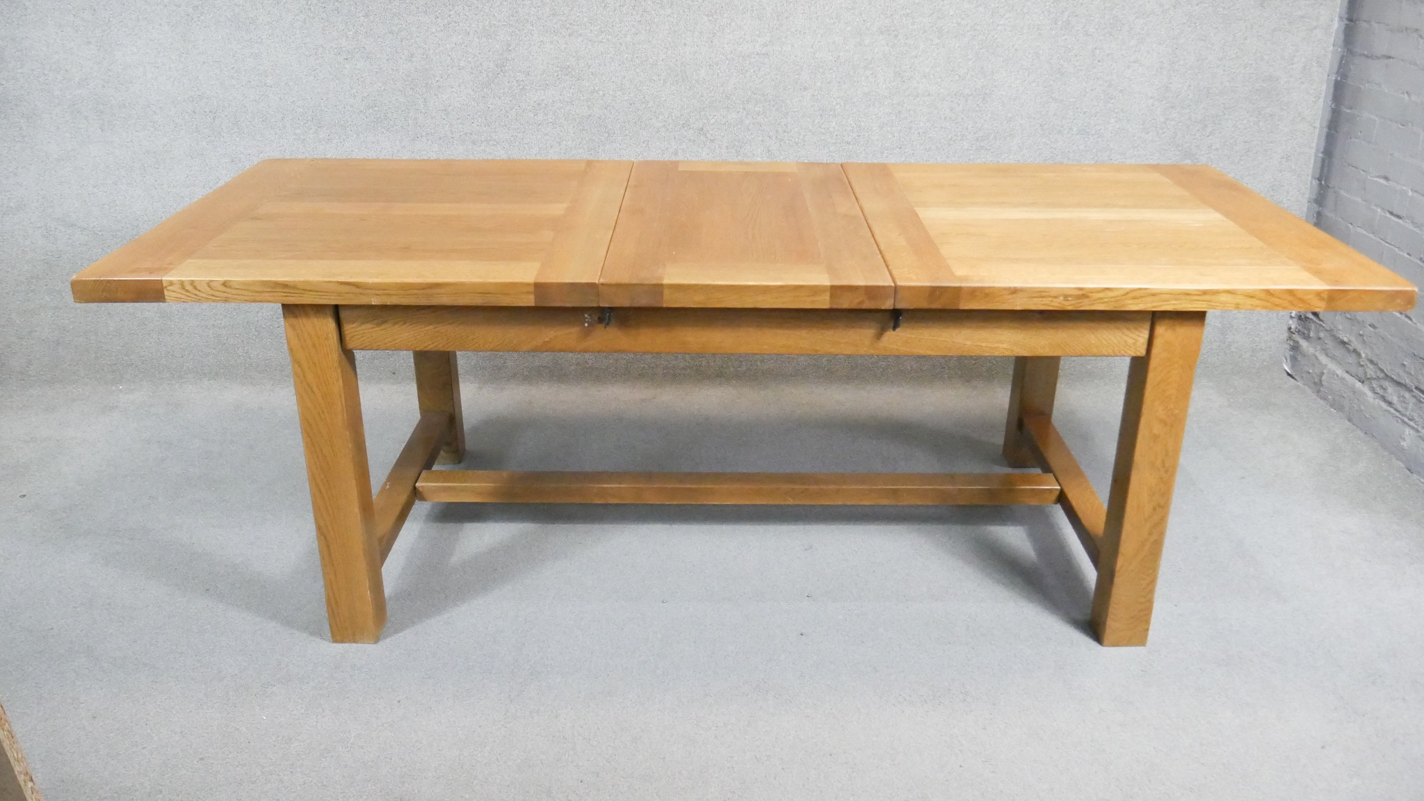 A contemporary John Lewis light oak planked top extending dining table on stretchered square - Image 4 of 5