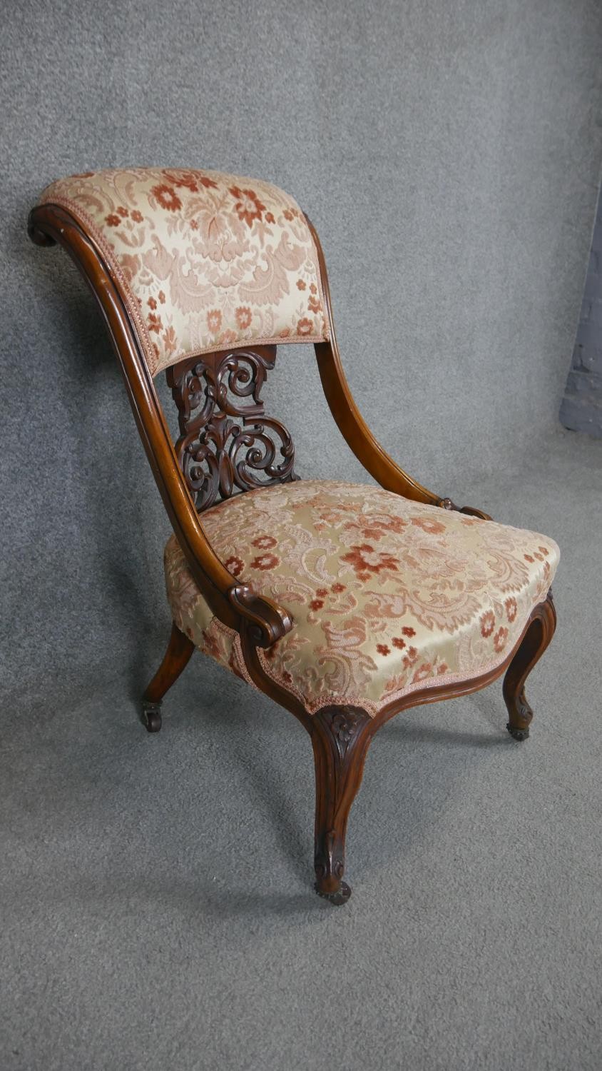 A Victorian carved walnut nursing chair on cabriole supports. - Image 2 of 4