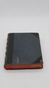 A 19th century leather bound and gilded bible with hand written inscription. H. 6 W. 23 D. 28