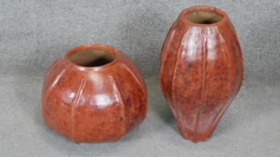 One ovoid ribbed terracotta effect ceramic vase along with a similar circular one. H.44CM