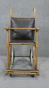 A late 19th century wheeled chair with bentwood frame. H.110 W.55