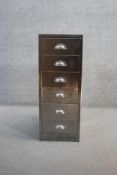A vintage steel six drawer filing cabinet with metal cup handles. H.90 W.35 D.45
