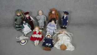A collection of ten dolls. Including porcelain and a Minime from Austin Powers doll. H.46cm (