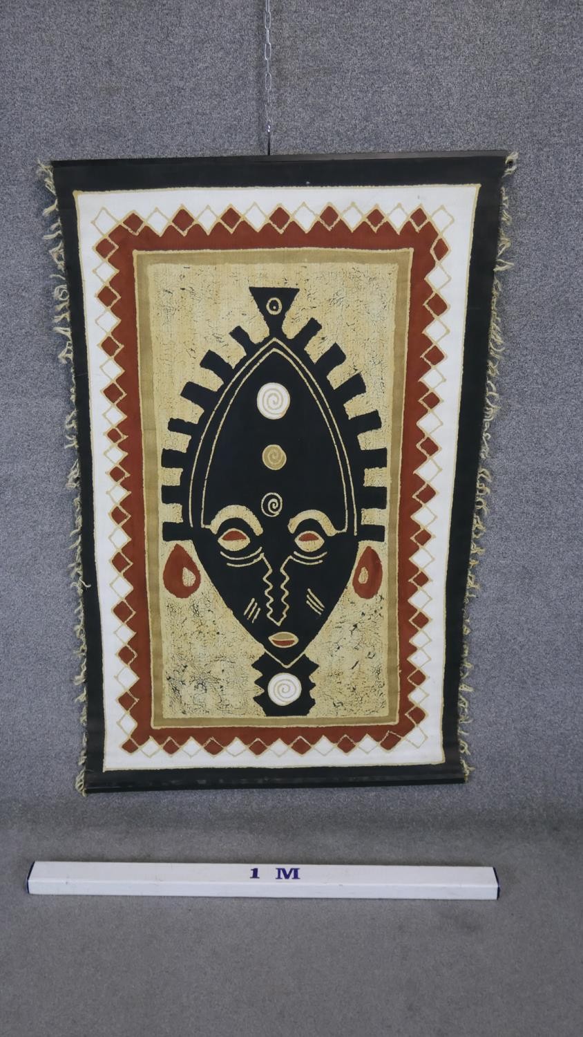 An tribal mask wall hanging on canvas with wooden poles. H.140 W.90 - Image 2 of 3