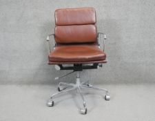 A chrome framed office chair with tilt and swivel action in faux leather upholstery on a five