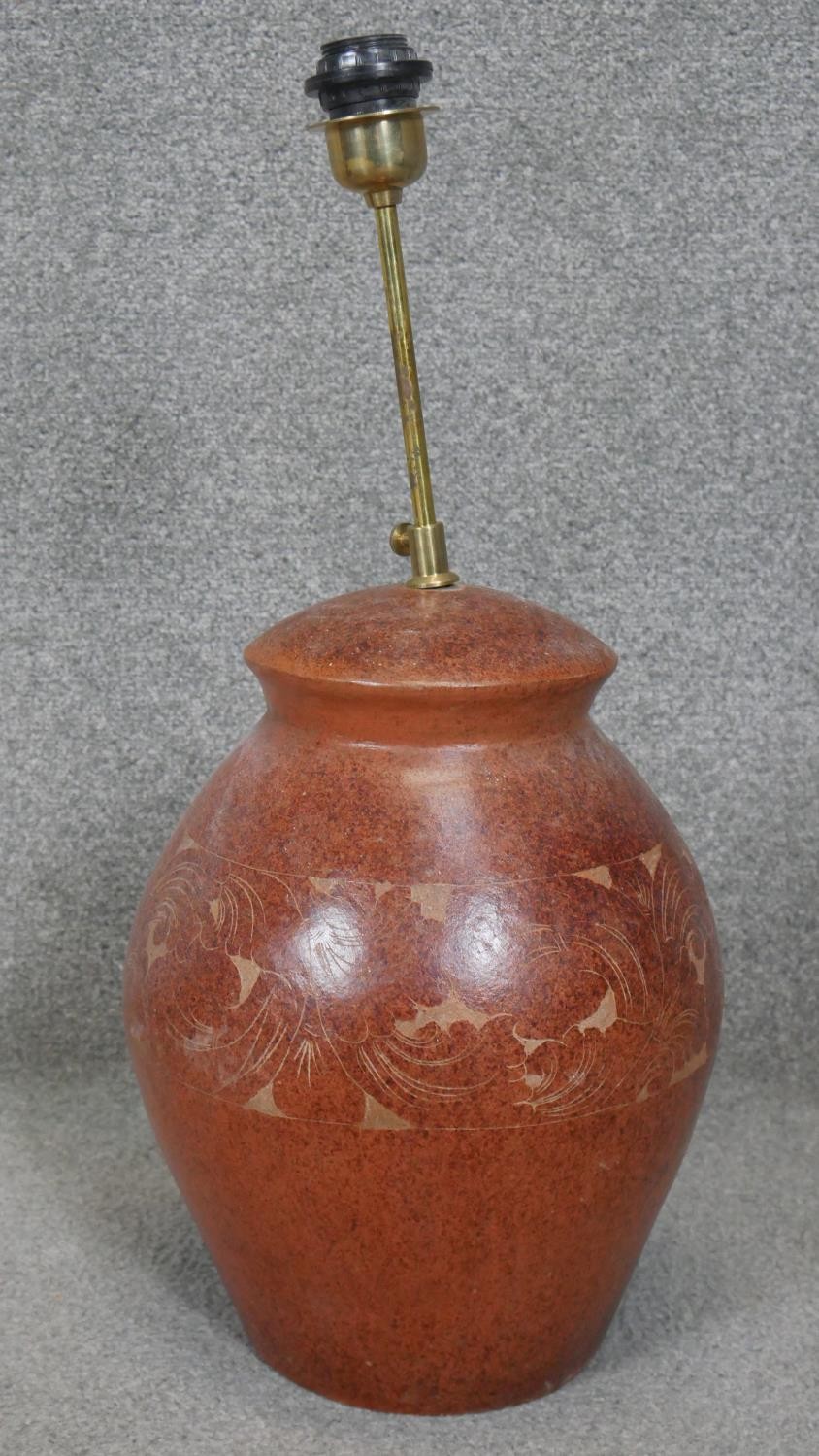 Two floral engraved terracotta effect ceramic table lamps with brass fittings. H.56CM - Image 3 of 3