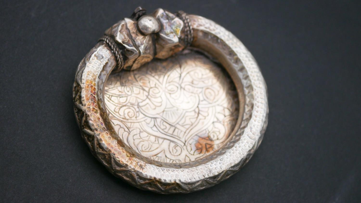 A collection of silver items. Including a silver sandal with engraved detailing, two foliate - Image 3 of 4