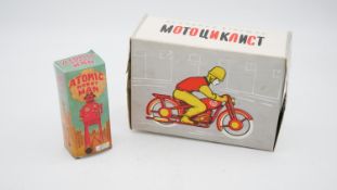 Two vintage tin plate toys. Including a boxed Russian Motounkanct motocyclist tin plate toy (no key)