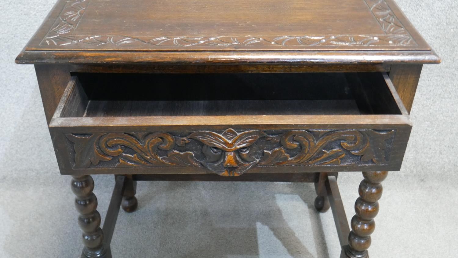 A mid century oak side table with mask carved frieze drawer on bobbin turned supports. H. 79 W. 69 - Image 3 of 5