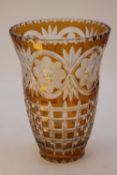 A vintage large Bohemian amber cut to clear glass vase with floral, foliate and cross hatched