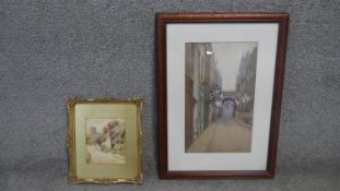 Two framed and glazed watercolours. One of a countryside lane signed Carter and a street scene
