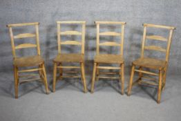 A set of four 19th century fruitwood bar back kitchen chairs with elm seats.