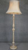 A mid century limed oak standard lamp and shade on fluted baluster column. H.80 D.34