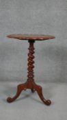 A Victorian mahogany occasional table with shaped moulded top on spiral twist support on tripod