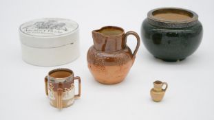 A collection of ceramics and porcelain. Including a miniatute Doulton tig with silver collar,