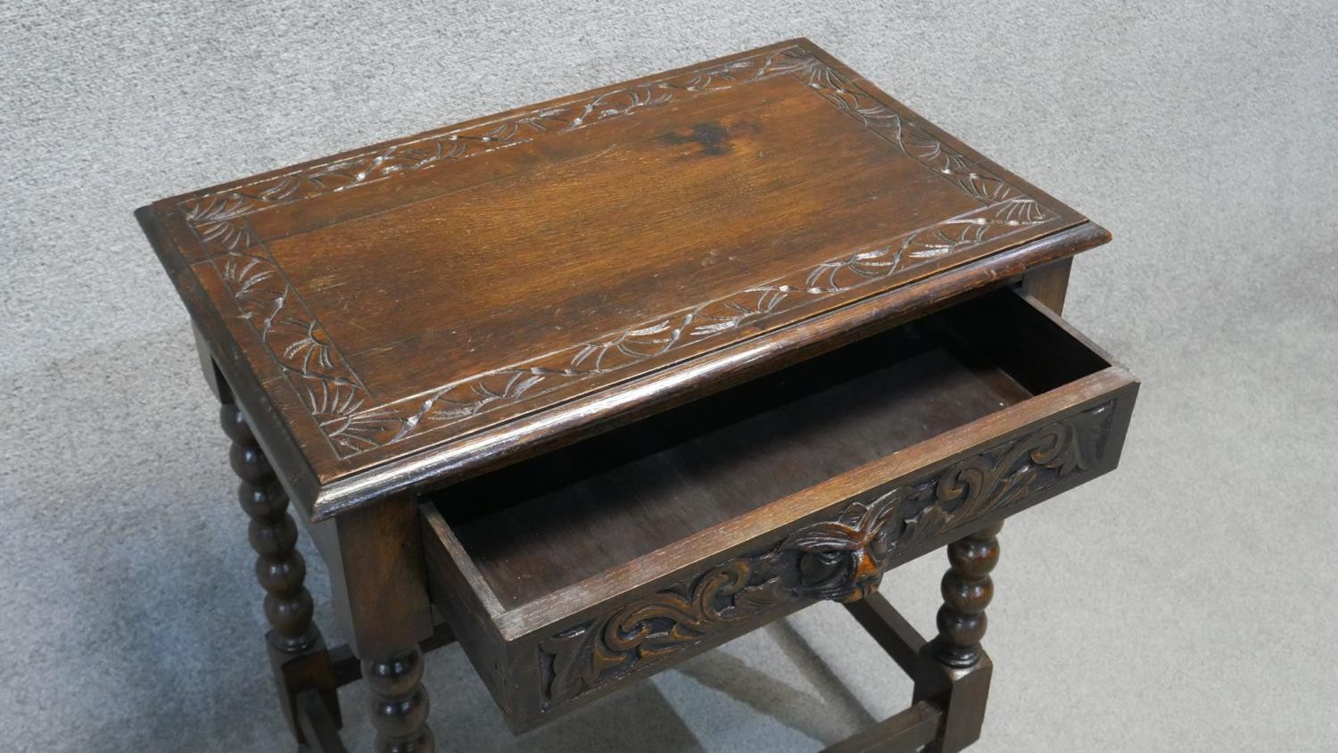 A mid century oak side table with mask carved frieze drawer on bobbin turned supports. H. 79 W. 69 - Image 4 of 5