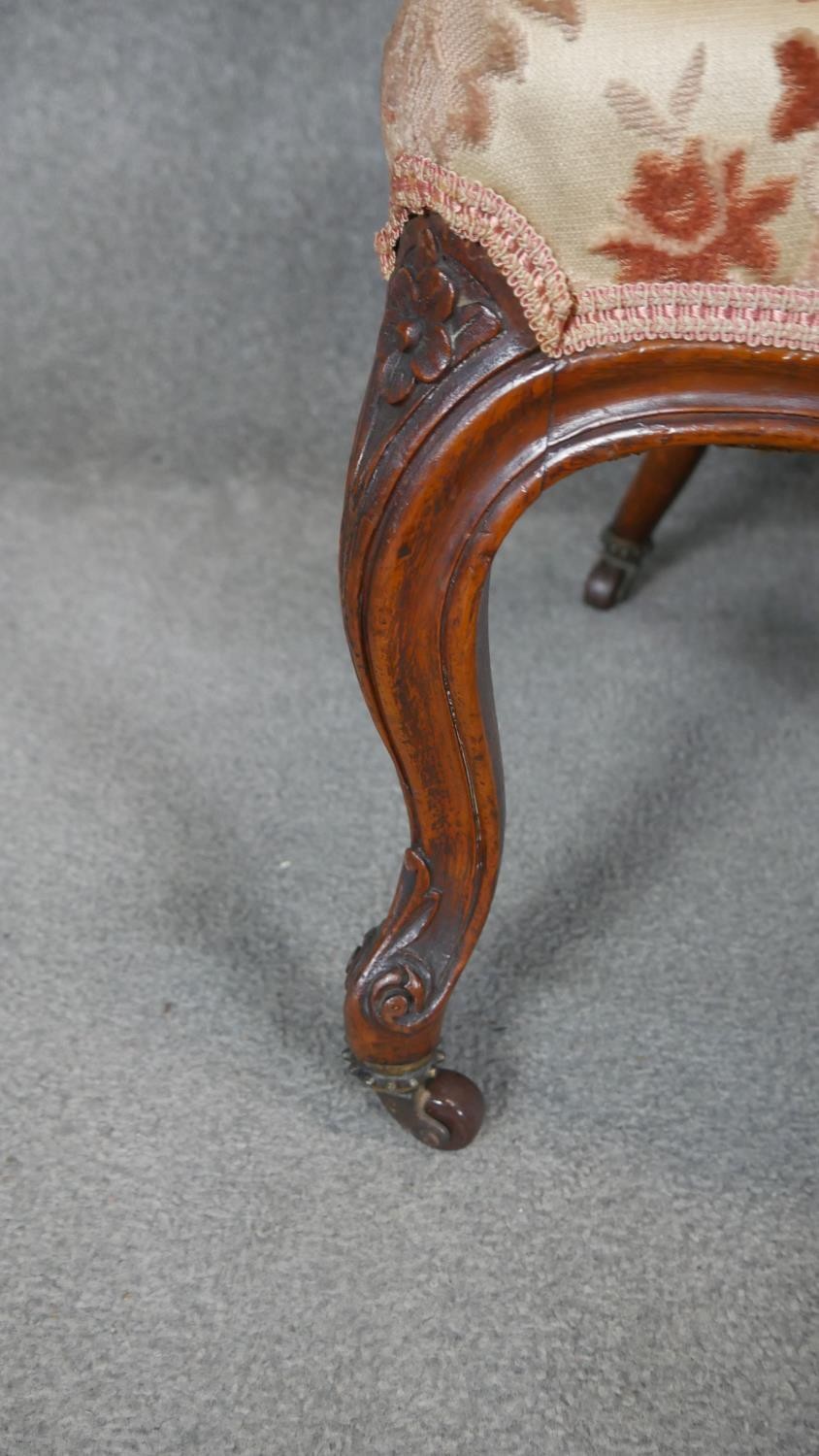 A Victorian carved walnut nursing chair on cabriole supports. - Image 3 of 4