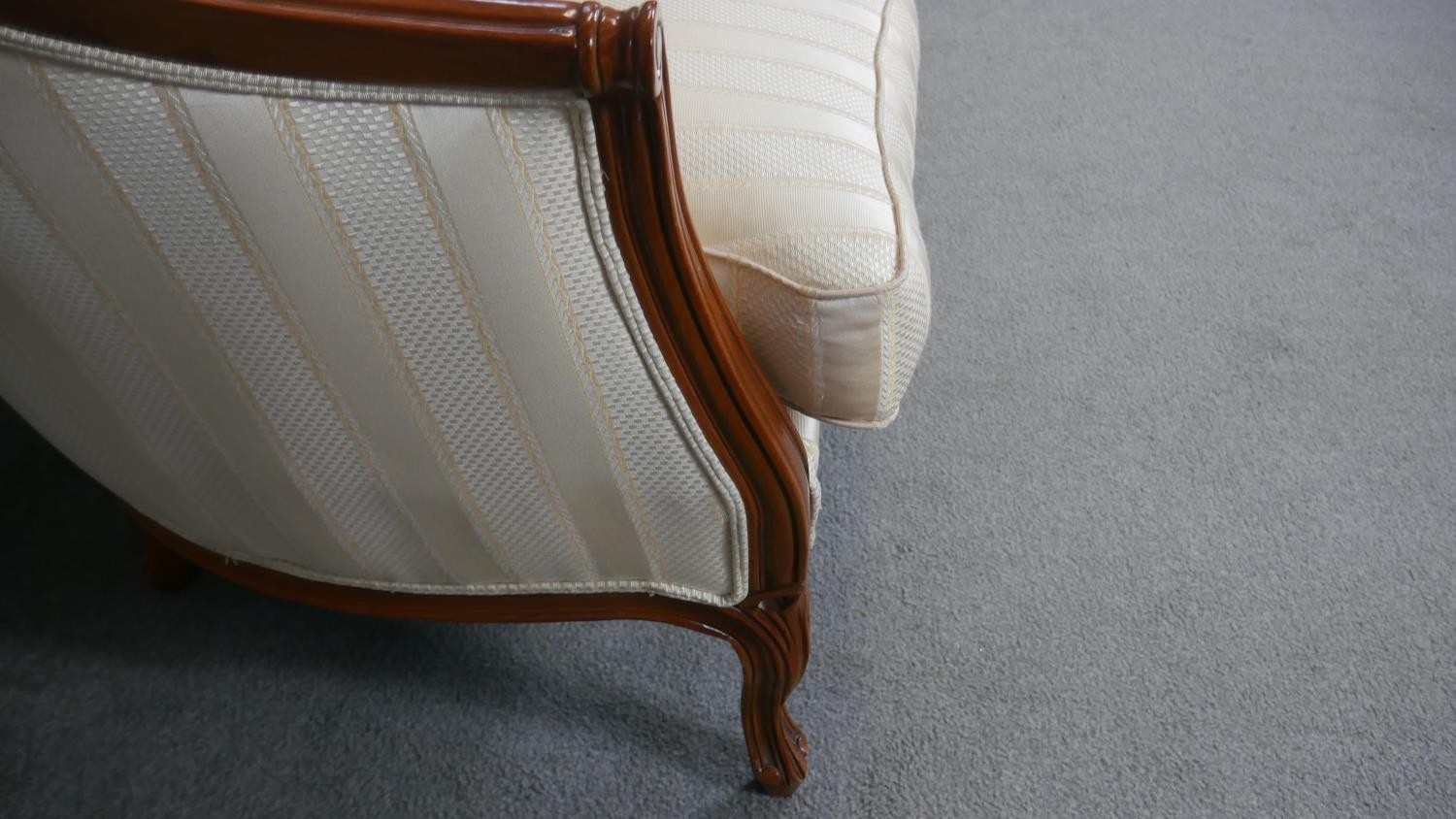 A Louis XV style two seater canape in striped upholstery on carved cabriole supports. - Image 4 of 5