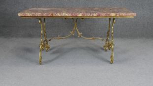 A mid century vintage marble topped low coffee table on scrolling foliate brass base. H.43 W.90 D.45