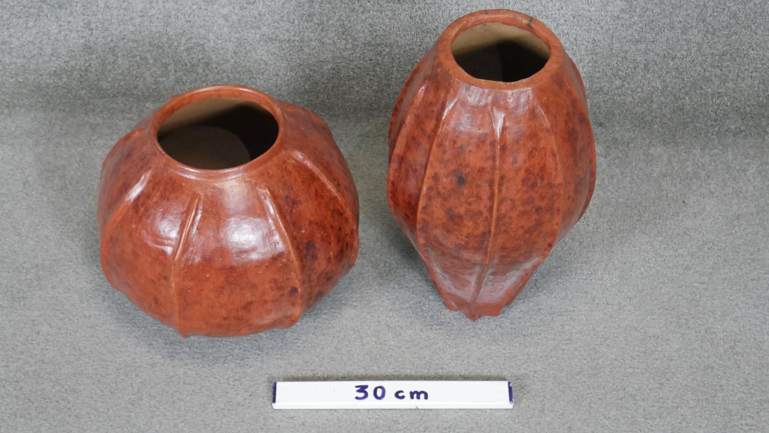 One ovoid ribbed terracotta effect ceramic vase along with a similar circular one. H.44CM - Image 2 of 4
