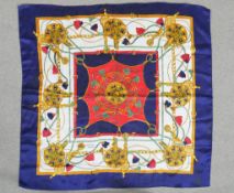 A vintage Hermes, Paris designer silk scarf depicting lion medallions, chains and tassels. L.87 W.