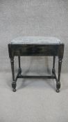 A mid century piano stool fitted with fall front sheet music drawer. H. 57 W. 50 D. 40