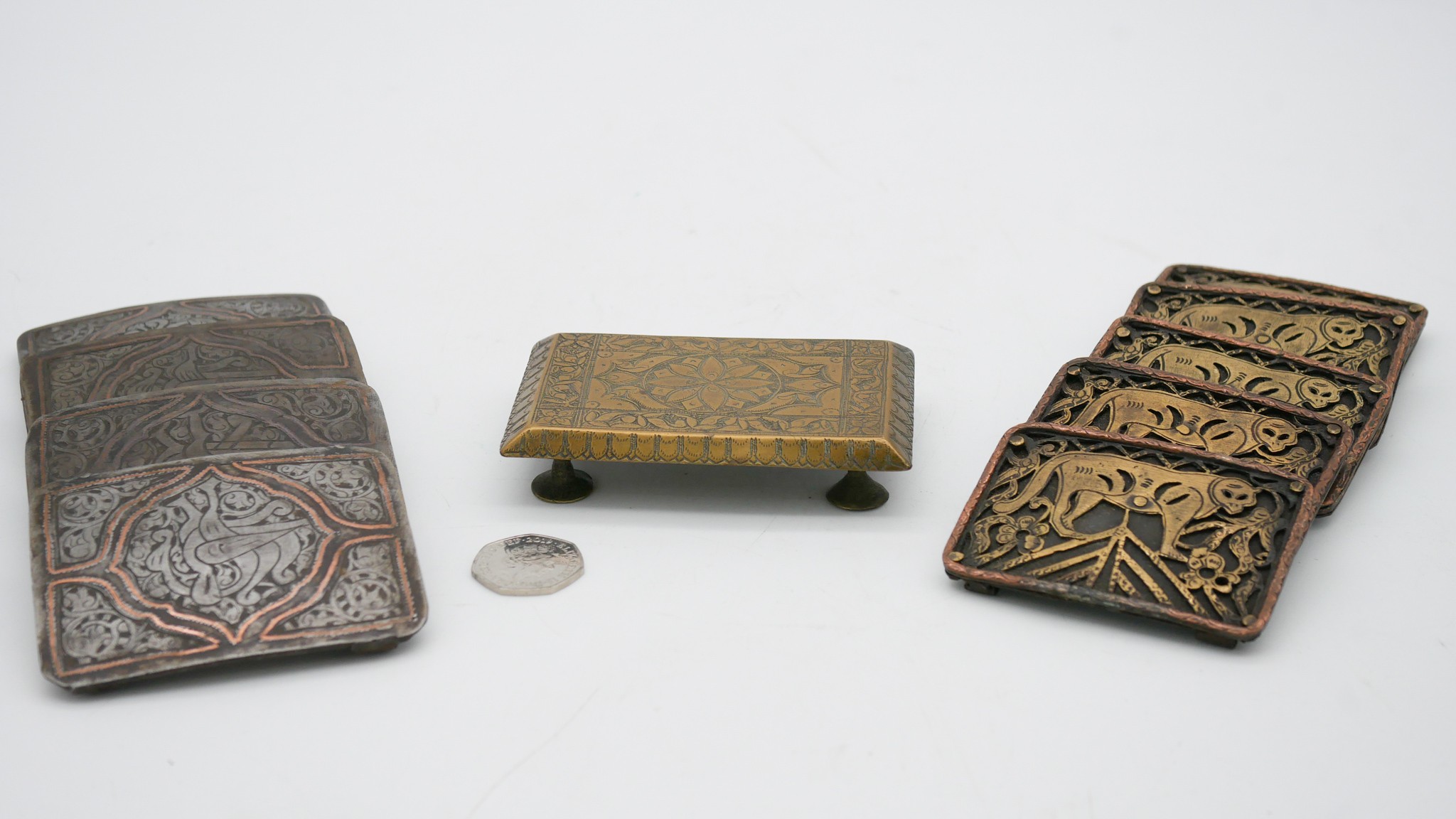 Two sets of metal Oriental buckles, one set of four with tiger motifs and the other set with a - Image 2 of 5